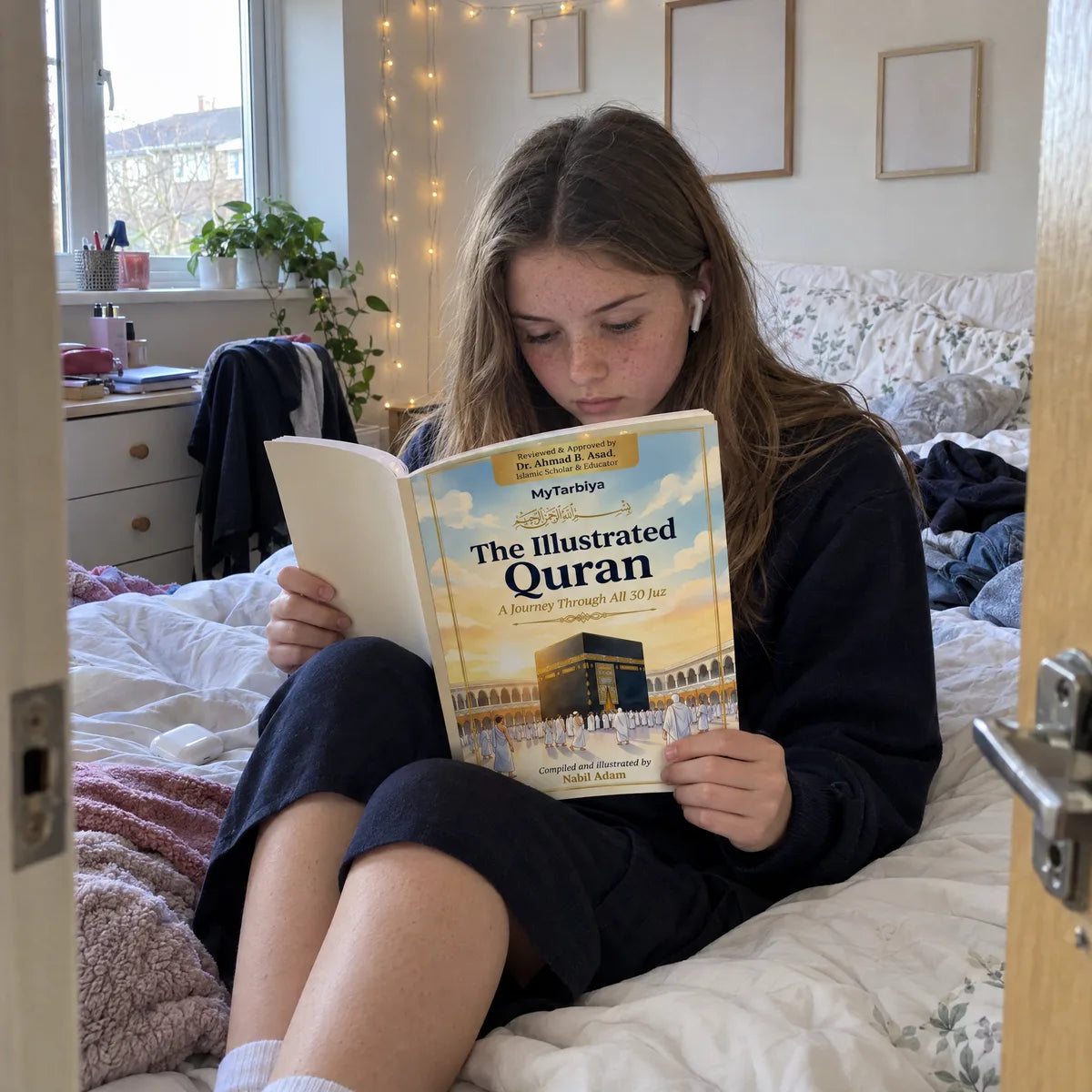 A teenager reading The Illustrated Quran alone on her bed